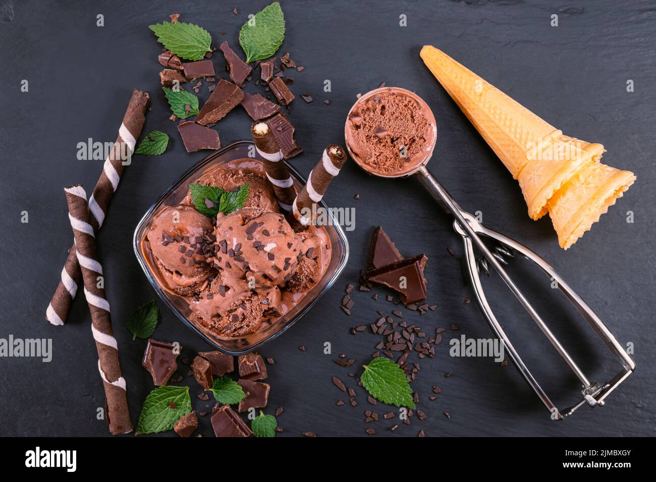 Scoops chocolate ice cream in glass bowl Stock Photo Alamy
