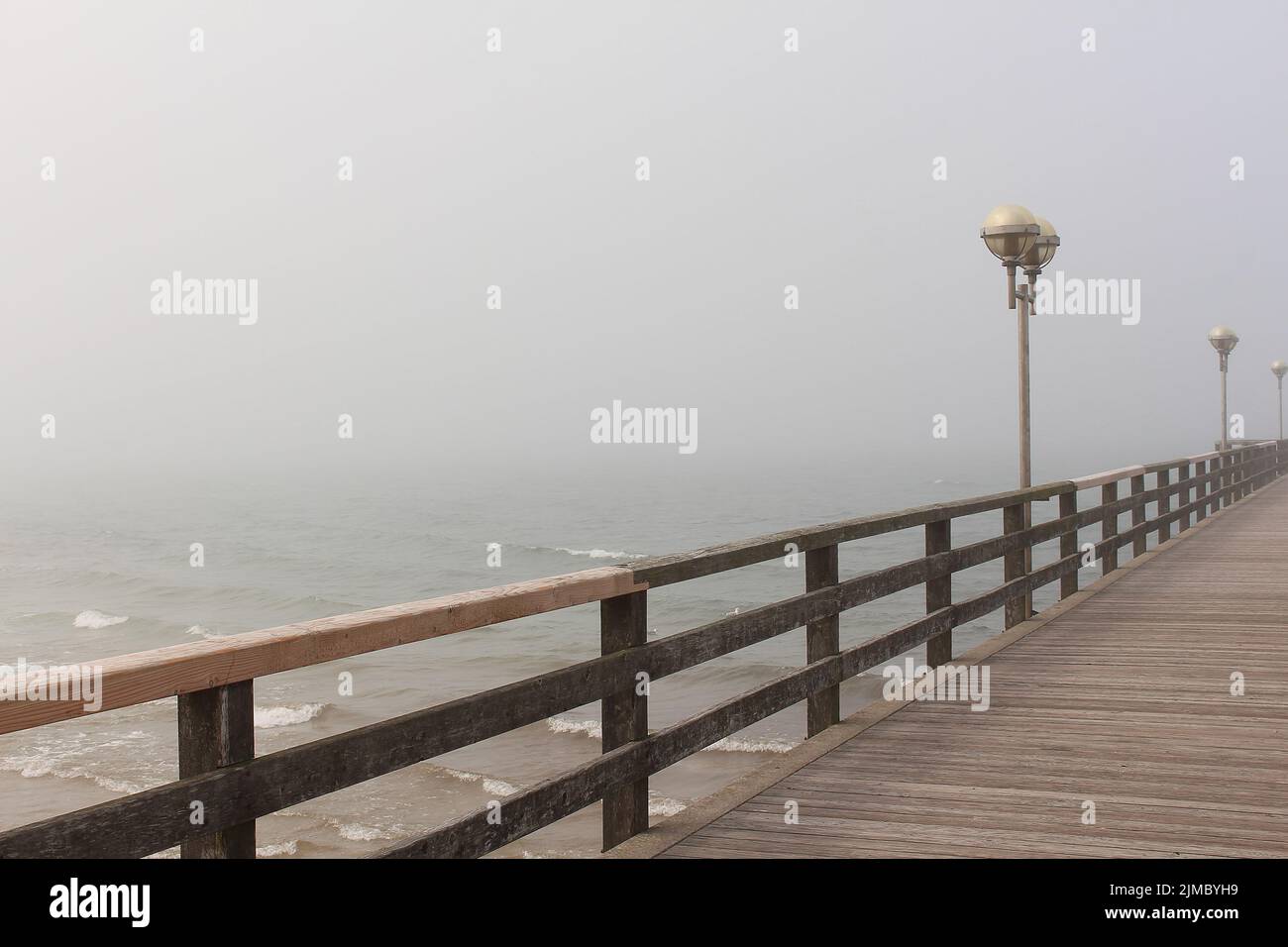 Pier in Costal Fog Stock Photo