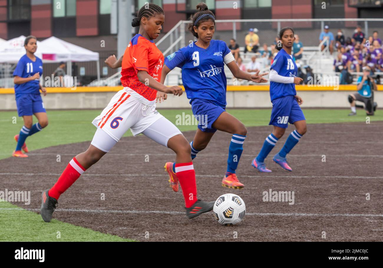 Detroit, Michigan - The women's teams of India and Namibia meet in the Special Olympics Unified Cup football (soccer) tournament. The Unified Cup pair Stock Photo