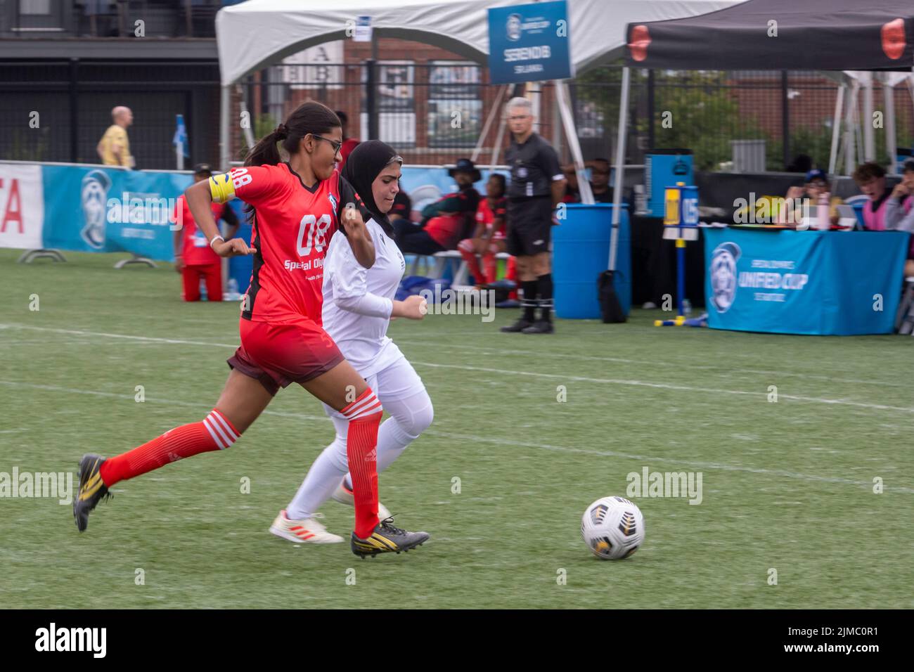 Detroit, Michigan - The women's teams of the United Arab Emirates and Sri Lanka meet in the Special Olympics Unified Cup football (soccer) tournament. Stock Photo