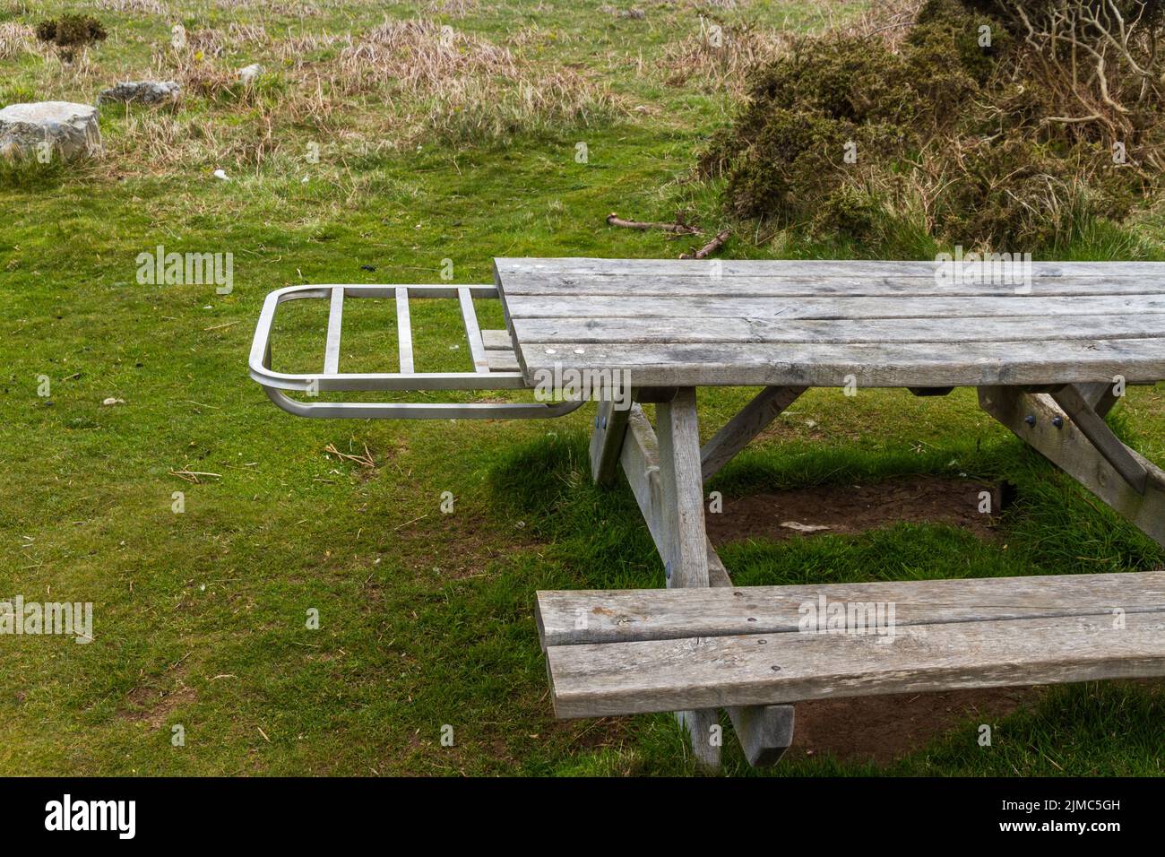 Picnic bench with metal shelf to hold disposable, landscape Stock Photo