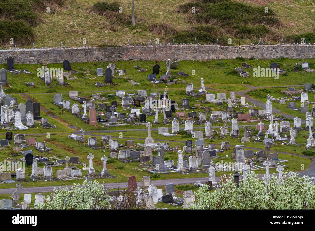 Large hillside cemetery. St. Tudnos Church Llandudno, North Wales, UK Stock Photo