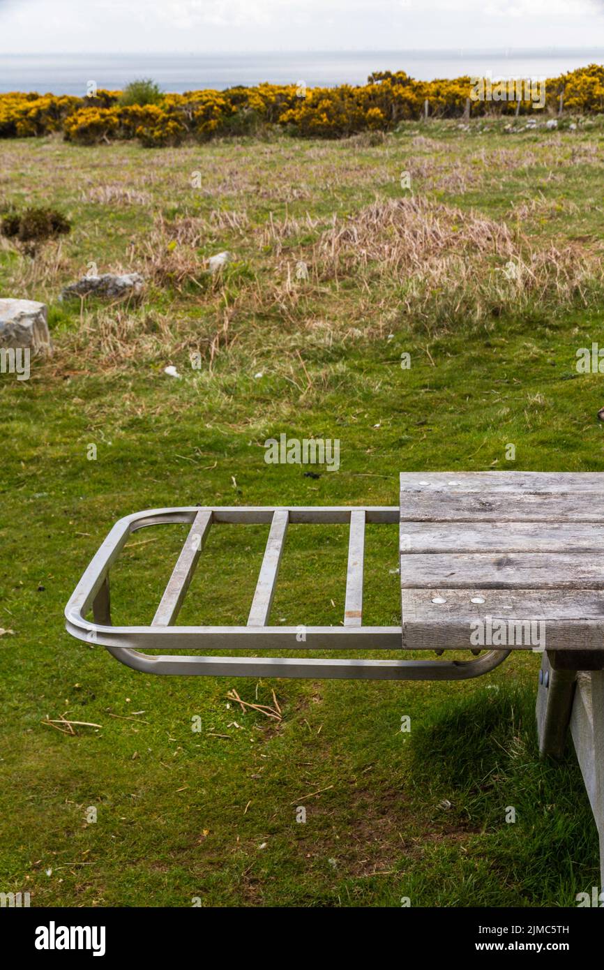 Picnic bench with metal shelf to hold disposable, portrait , close up Stock Photo