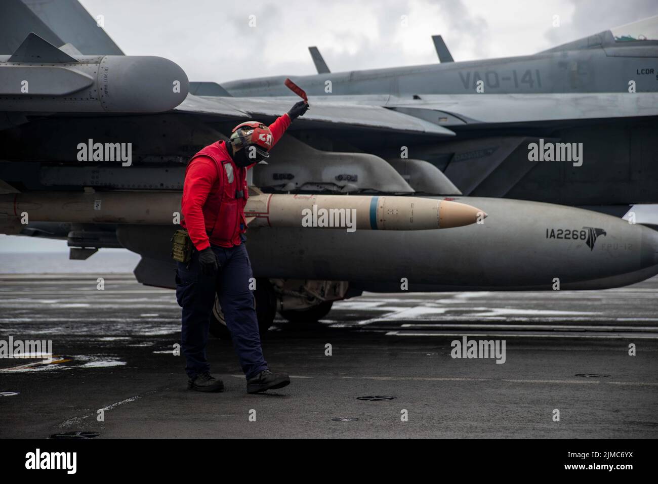 Pacific Ocean, United States. 04th Aug, 2022. U.S. Navy Aviation Ordnanceman Airman Devin Lockwood, arms rockets on an EA-18G Growler fighter aircraft assigned to the Shadowhawks of Electronic Attack Squadron 141, on the flight deck of the Nimitz-class aircraft carrier USS Ronald Reagan underway, August 4, 2022 in the Philippine Sea. Credit: MC3 Gray Gibson/Planetpix/Alamy Live News Credit: Planetpix/Alamy Live News Stock Photo