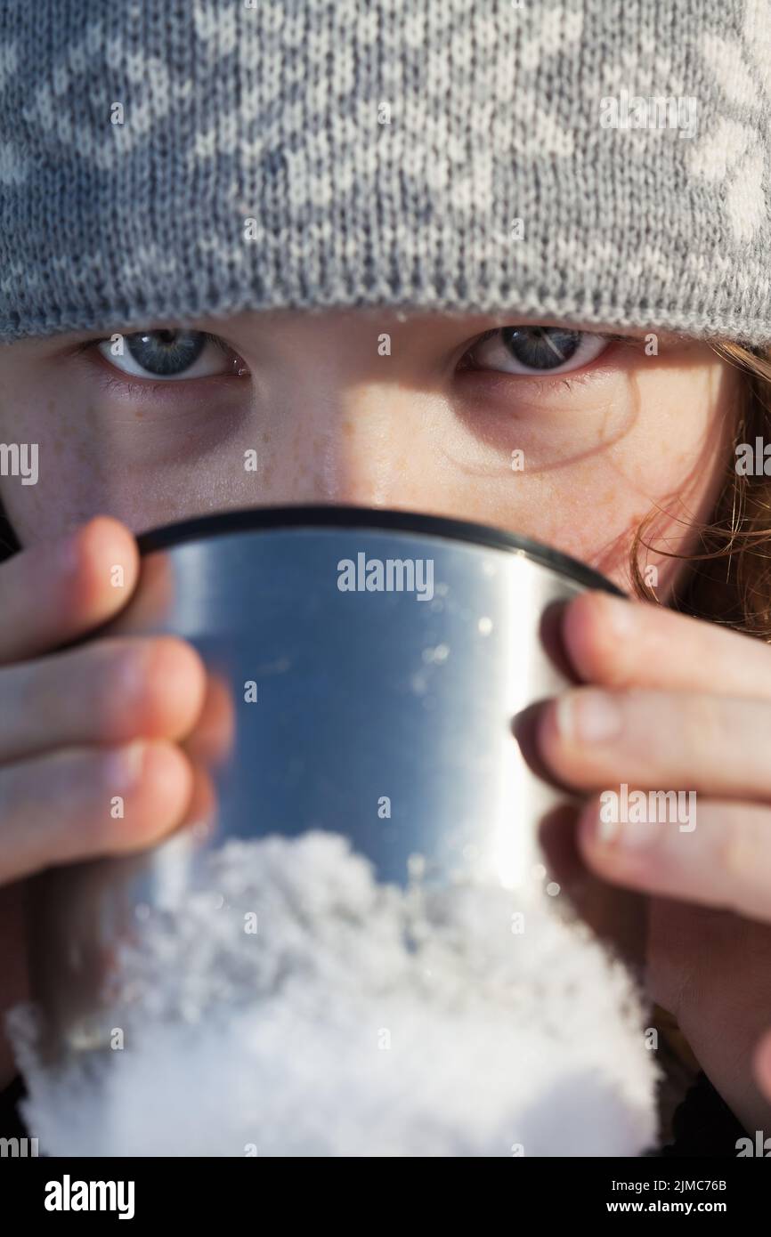Girl drinking from flask cup Stock Photo Alamy