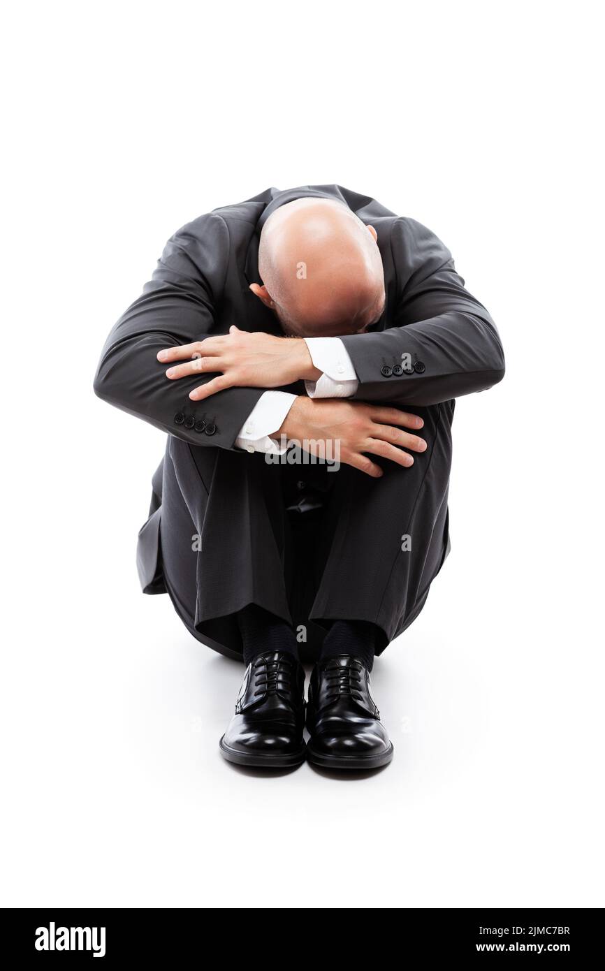 Crying tired or stressed businessman in depression hand hiding face Stock Photo