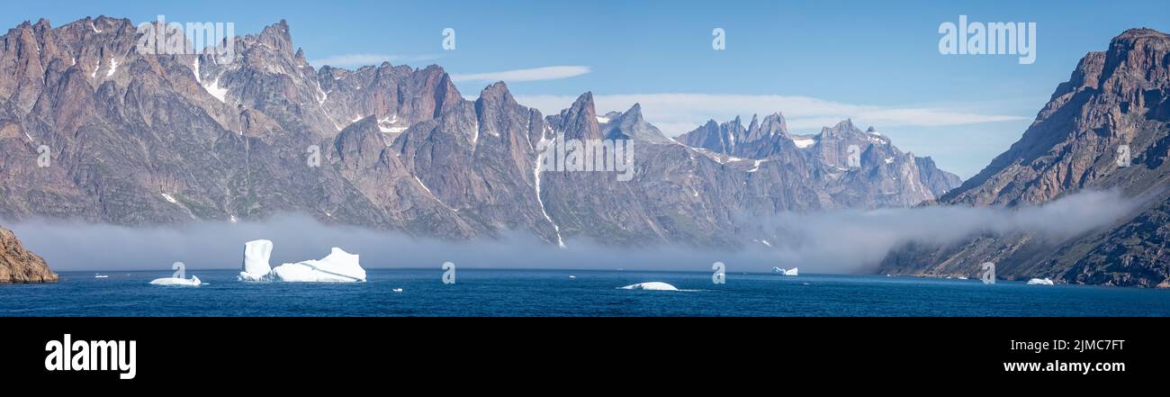 Panoramic landacpe of icebergs and mountains in Prince Christian Sound, South Greenland Stock Photo