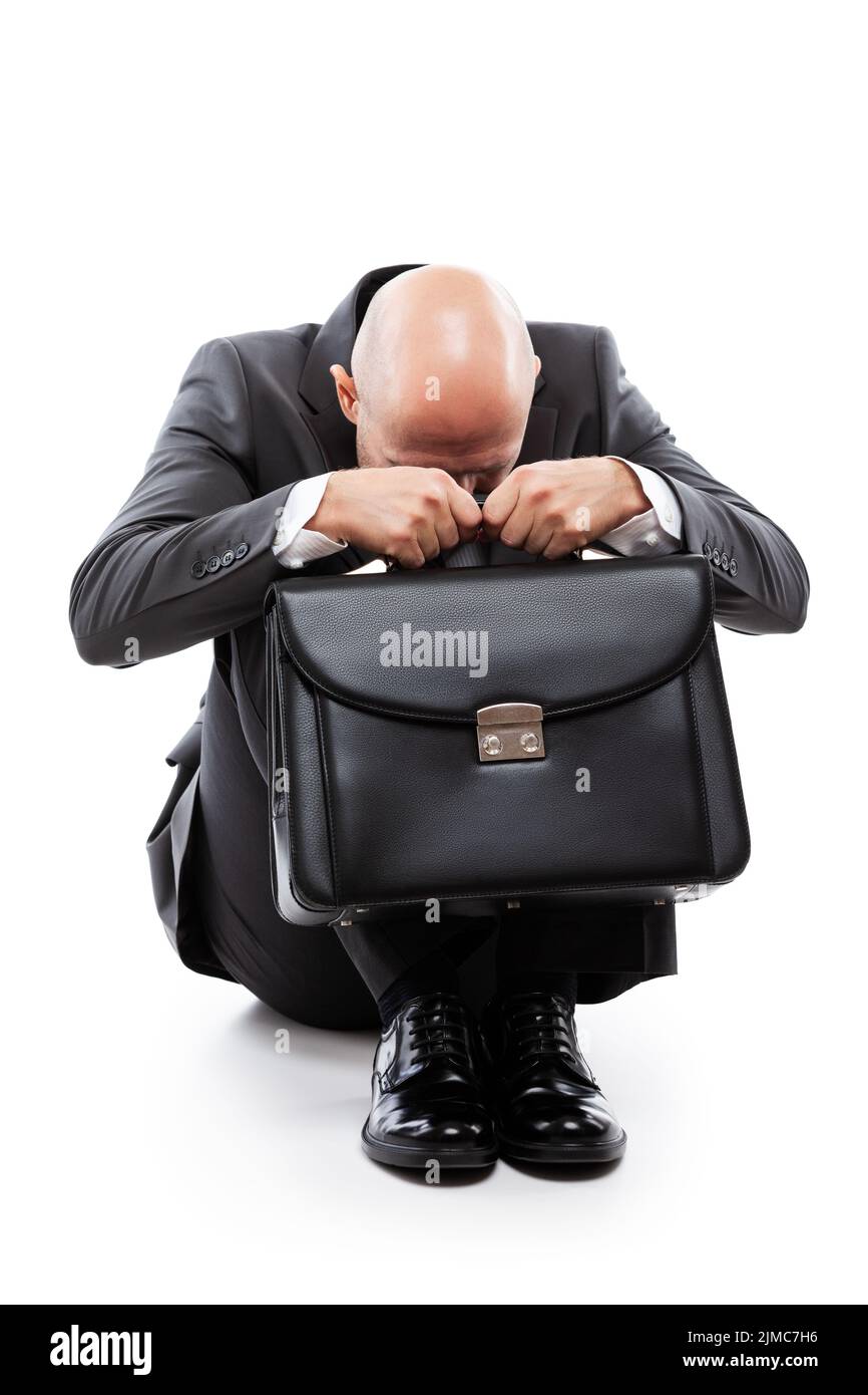 Crying tired or stressed businessman in depression hand holding briefcase Stock Photo