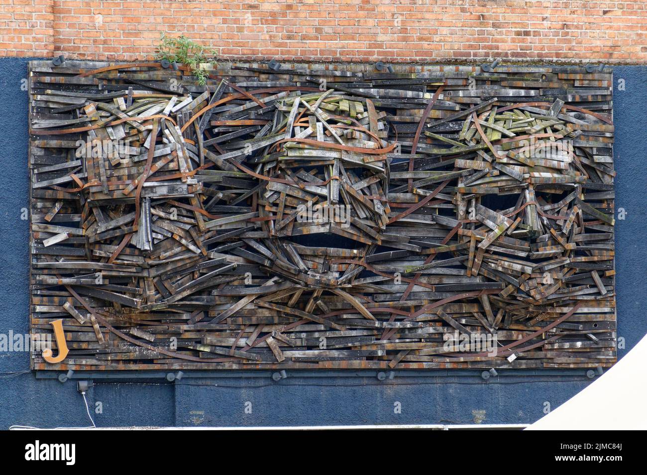 3D Wooden Wall Sculpture of 3 heads in Belfast City Centre, Northern