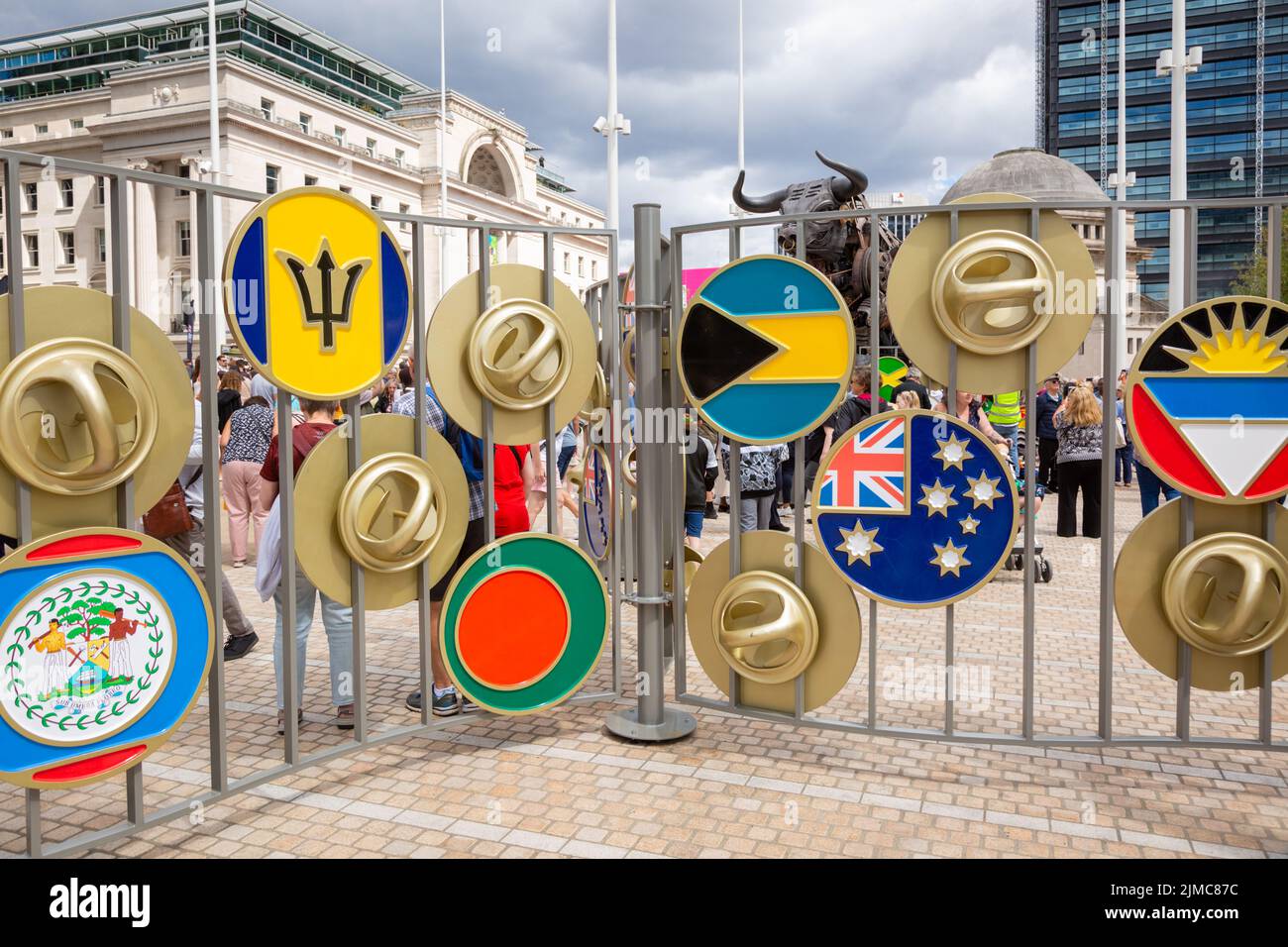 Large pin buttons on display representing Birmingham's manufacturing and the Commonwealth countries' flags on display in Centenary Square, Birmingham Stock Photo