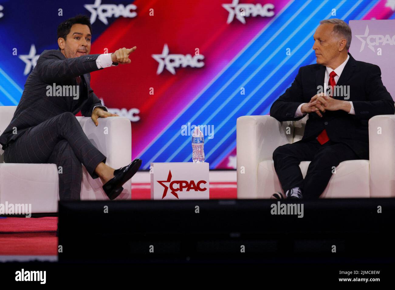 U.S. Representative Andy Biggs (R-AZ) listens as Brandon Straka, who founded #WalkAway and was convicted on charges linked to the January 6 attacks on the U.S. Capitol, speaks at the Conservative Political Action Conference (CPAC) in Dallas, Texas, U.S., August 5, 2022.  REUTERS/Brian Snyder Stock Photo