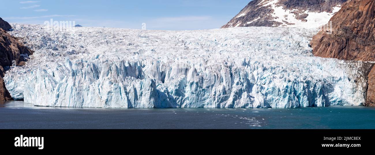 Panorama of the huge face of a craggy glacier in Prince Christian Sound, South Greenland Stock Photo