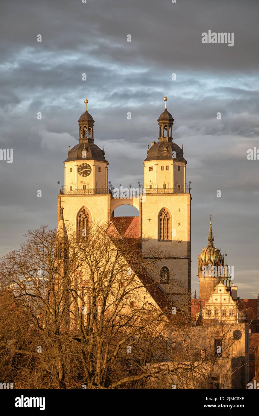 the towers of the town church of wittenberg in winter Stock Photo