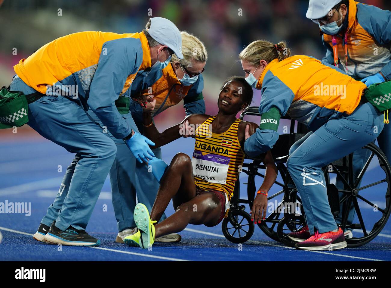 Uganda’s Peruth Chemutai receives medical attention after the Women’s