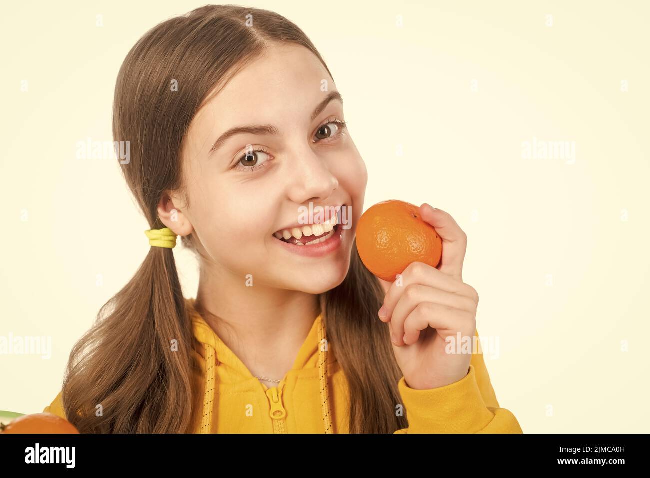 child eating healthy food. childhood health. citrus fruits. natural