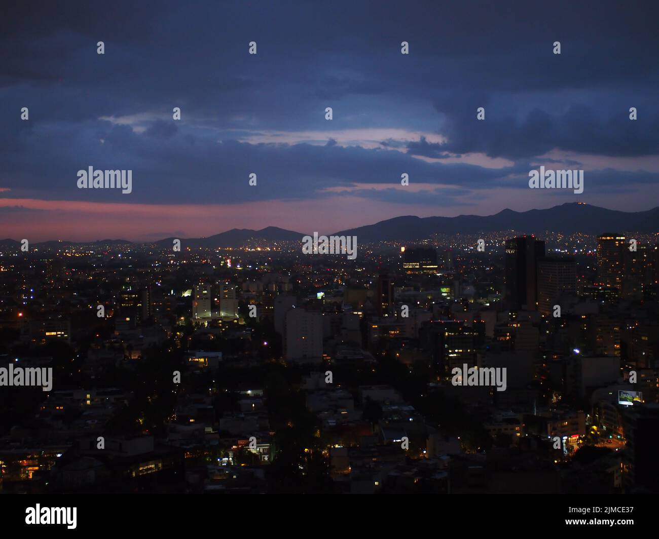 Night lights emerging from buildings and citycscape for Mexico City Stock Photo