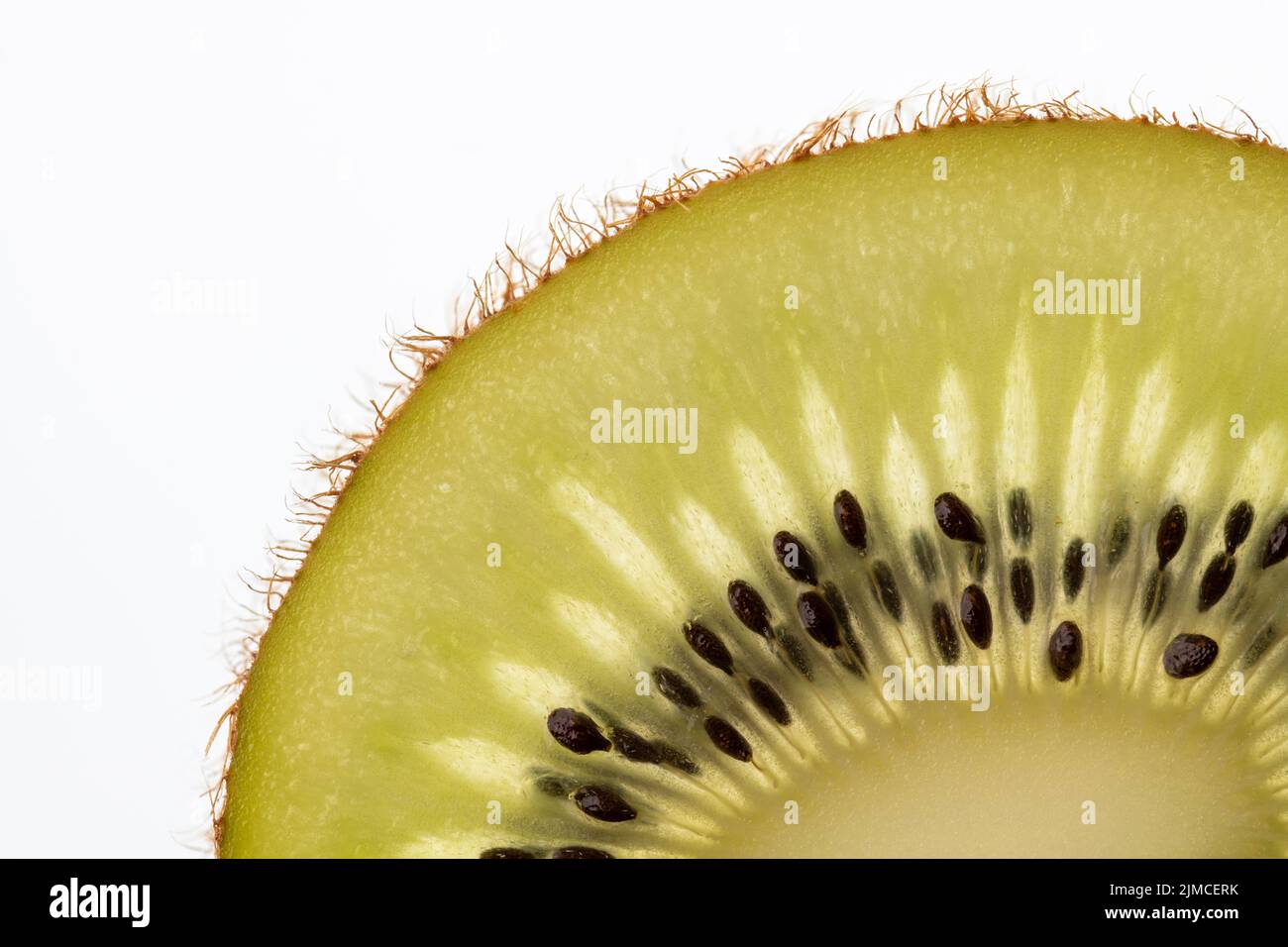 Part of a cut kiwi fruit in backlight foto shot Stock Photo