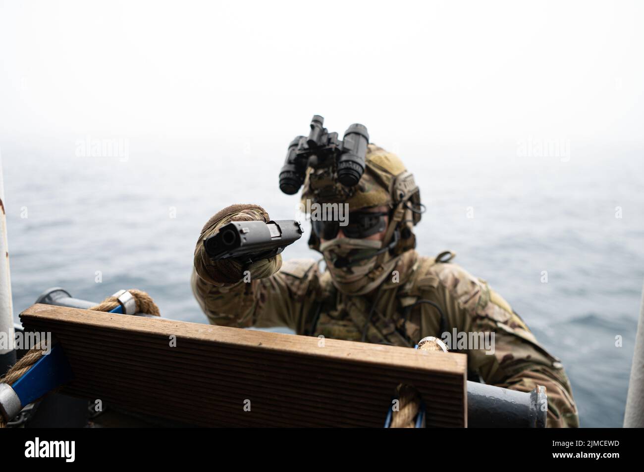 A U.S. Coast Guardsman attached to a Marine Security Response Team ...