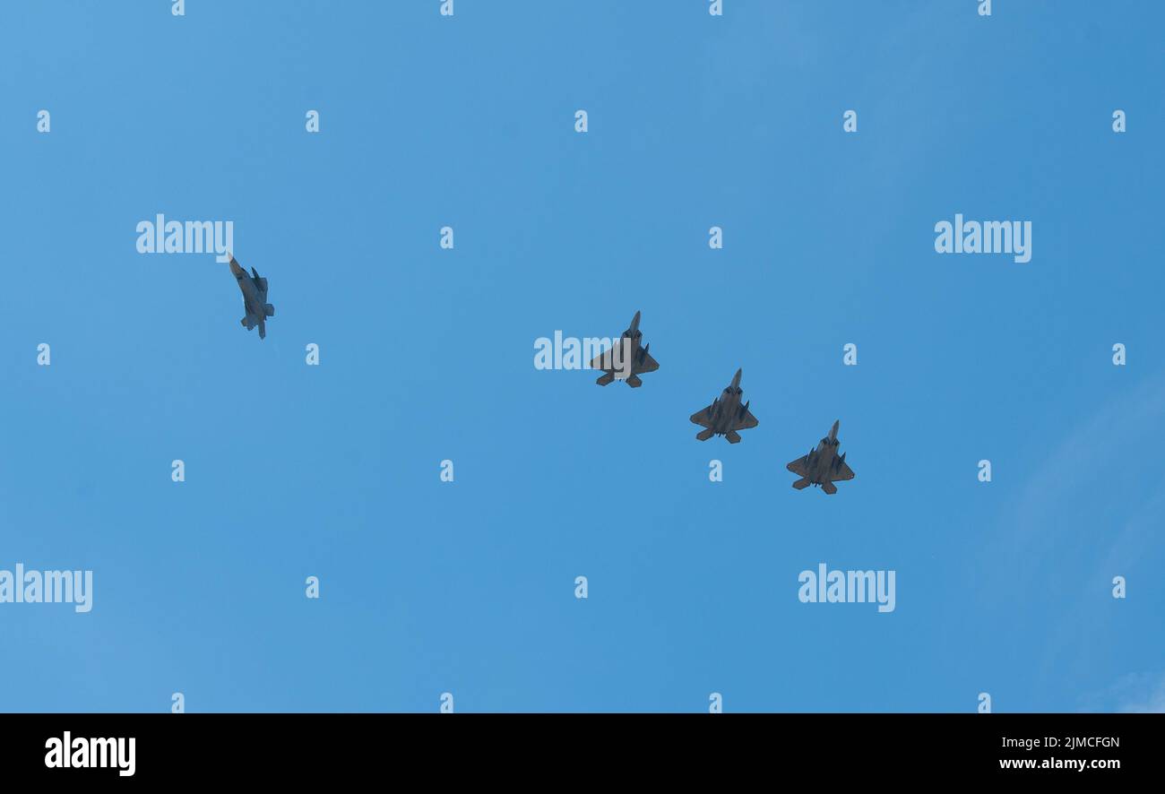 U.S. Air Force F-22 Raptors assigned to the 90th Fighter Squadron, 3rd Wing fly in formation as they arrive at the 32nd Tactical Air Base in Łask, Poland to support NATO Air Shielding in the European Theater August 4, 2022. The NATO Shielding mission is a joint integrated mission to increase the air and missile defense posture along the Eastern flank of the Alliance. (U.S. Air Force photo by Staff Sergeant Danielle Sukhlall) Stock Photo
