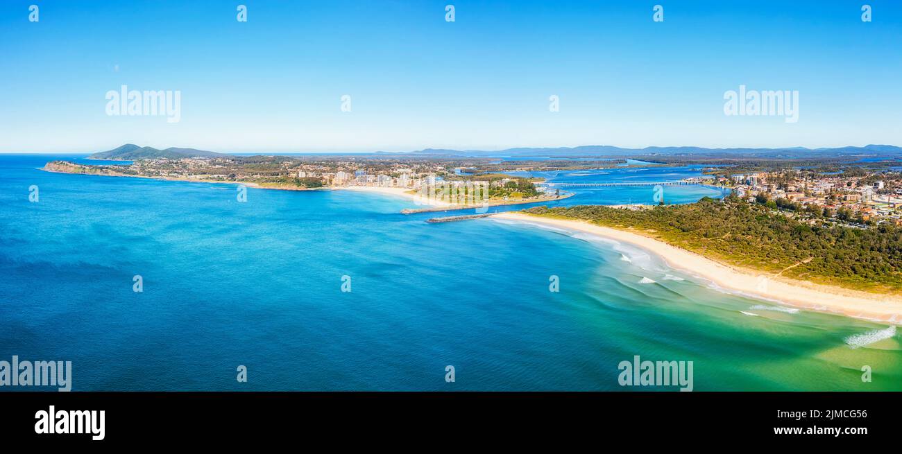 Scenic seascape of Wallis lake river mouth at Nine Mile beach in Forster-Tuncurry towns of Australia on pacific coast - aerial panorama. Stock Photo