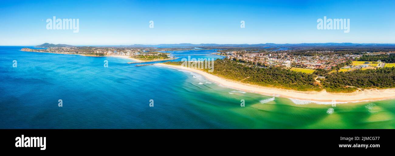Scenic seascape of Nine Mile beach in Tuncurry town of Australia on pacific coast - aerial panorama to Forster and Wallis lake. Stock Photo