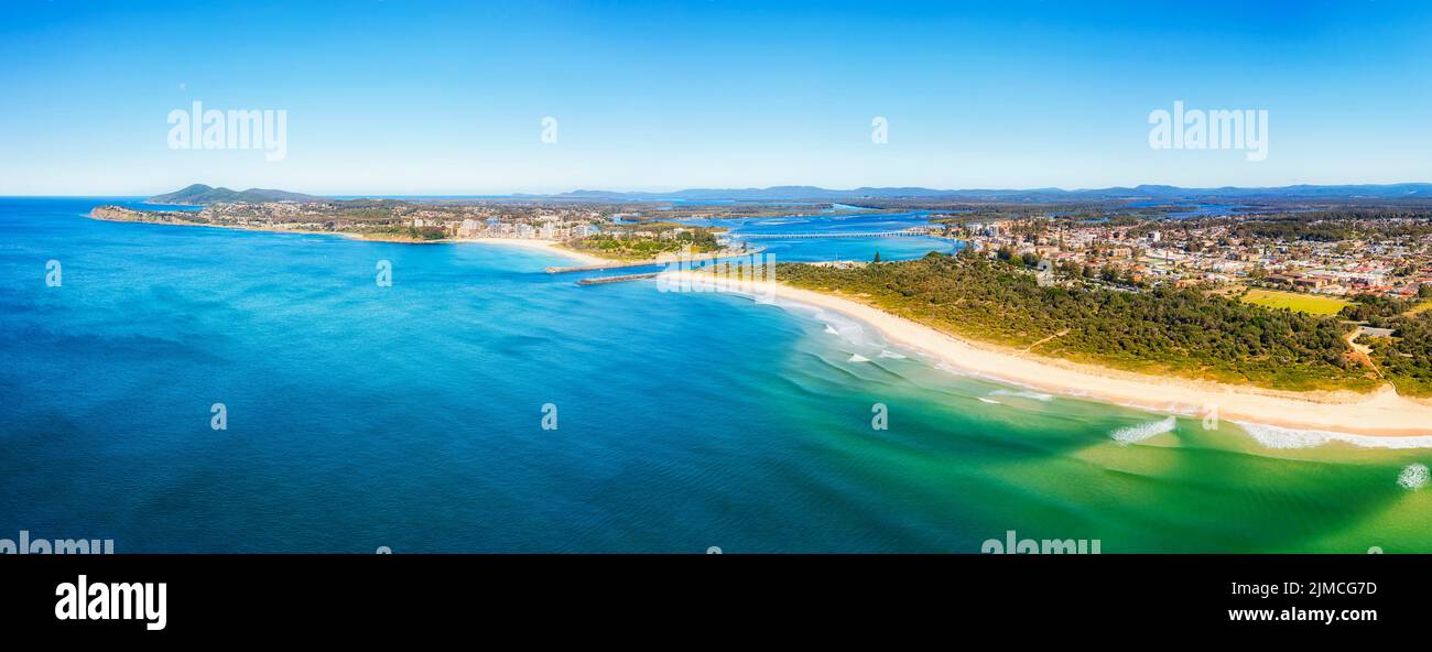 Scenic seascape of Nine Mile beach in Forster-Tuncurry towns of Australia on pacific coast - aerial panorama to Wallis lake and river delta. Stock Photo