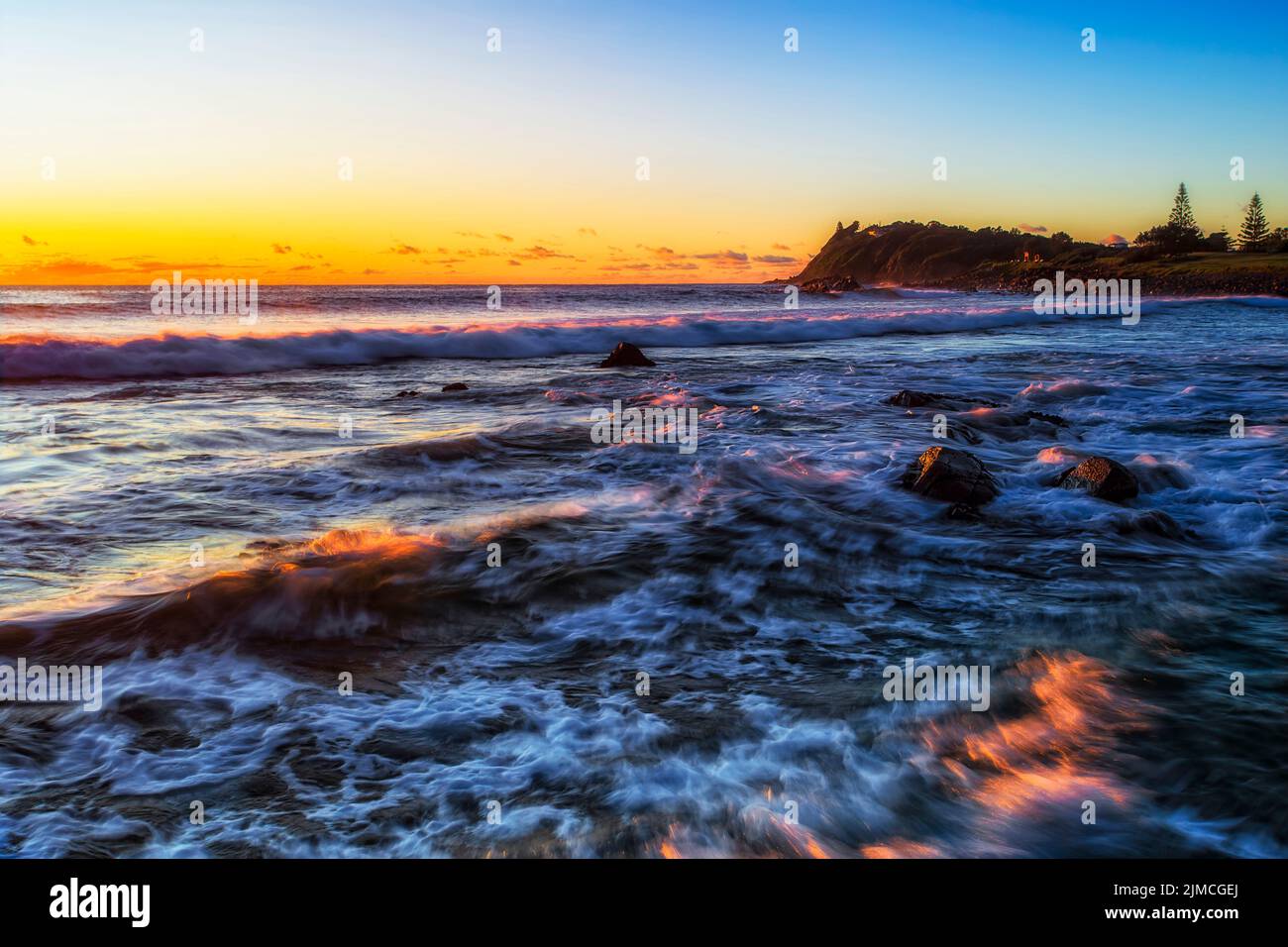 Seascape sunrise at Pebbly beach in Forster town on Pacific ocean coast of Australia. Stock Photo