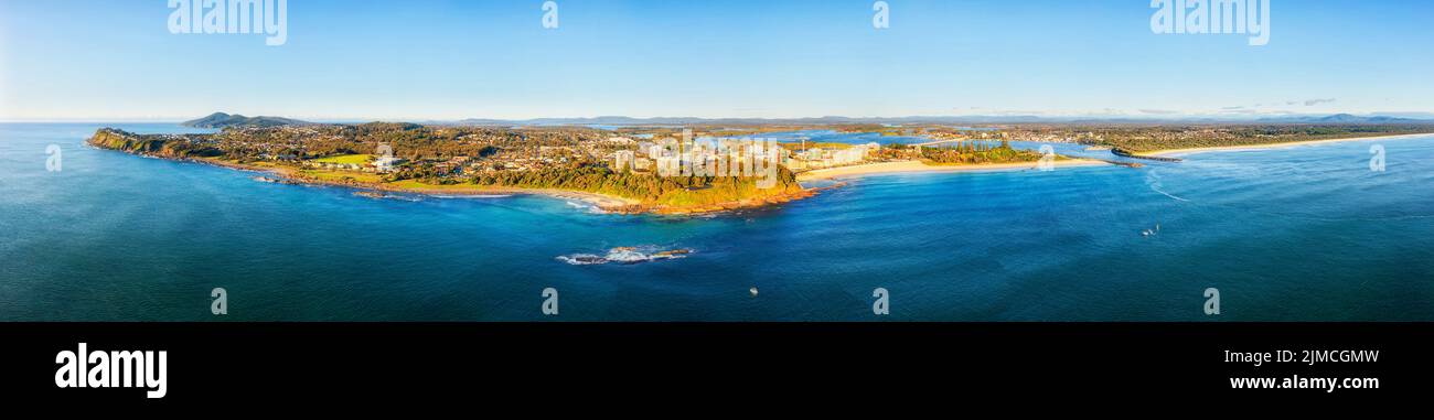 Wide aerial panorama of Pacific coast waterfront of Forster Tuncurry towns around Wallis street with river mouth and local beaches. Stock Photo