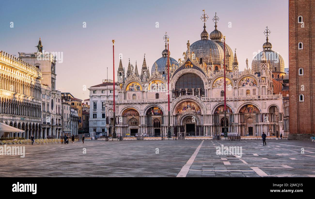 St. Mark's Square with clock tower and St. Mark's Basilica at sunrise, Venice, Veneto, Adriatic Sea, Northern Italy, Italy, Europe Stock Photo