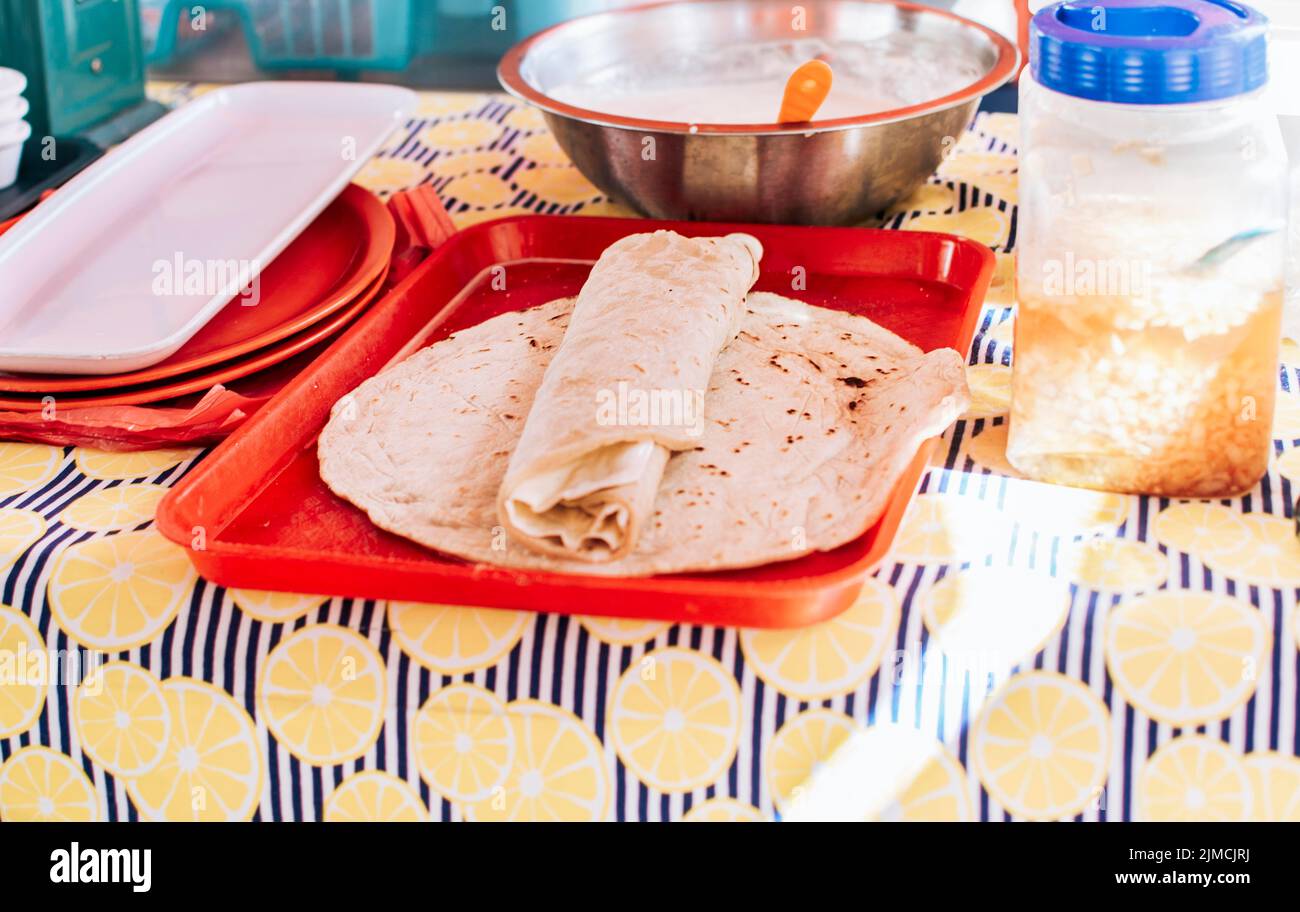 Nicaraguan quesillo made and served on the table. Traditional quesillo ...