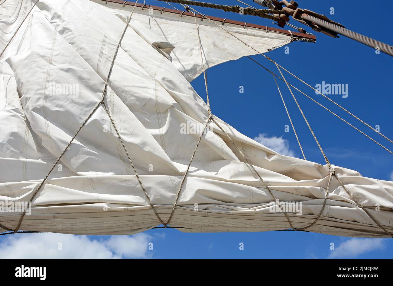 White sail hoisting, Baltic Sea Stock Photo Alamy