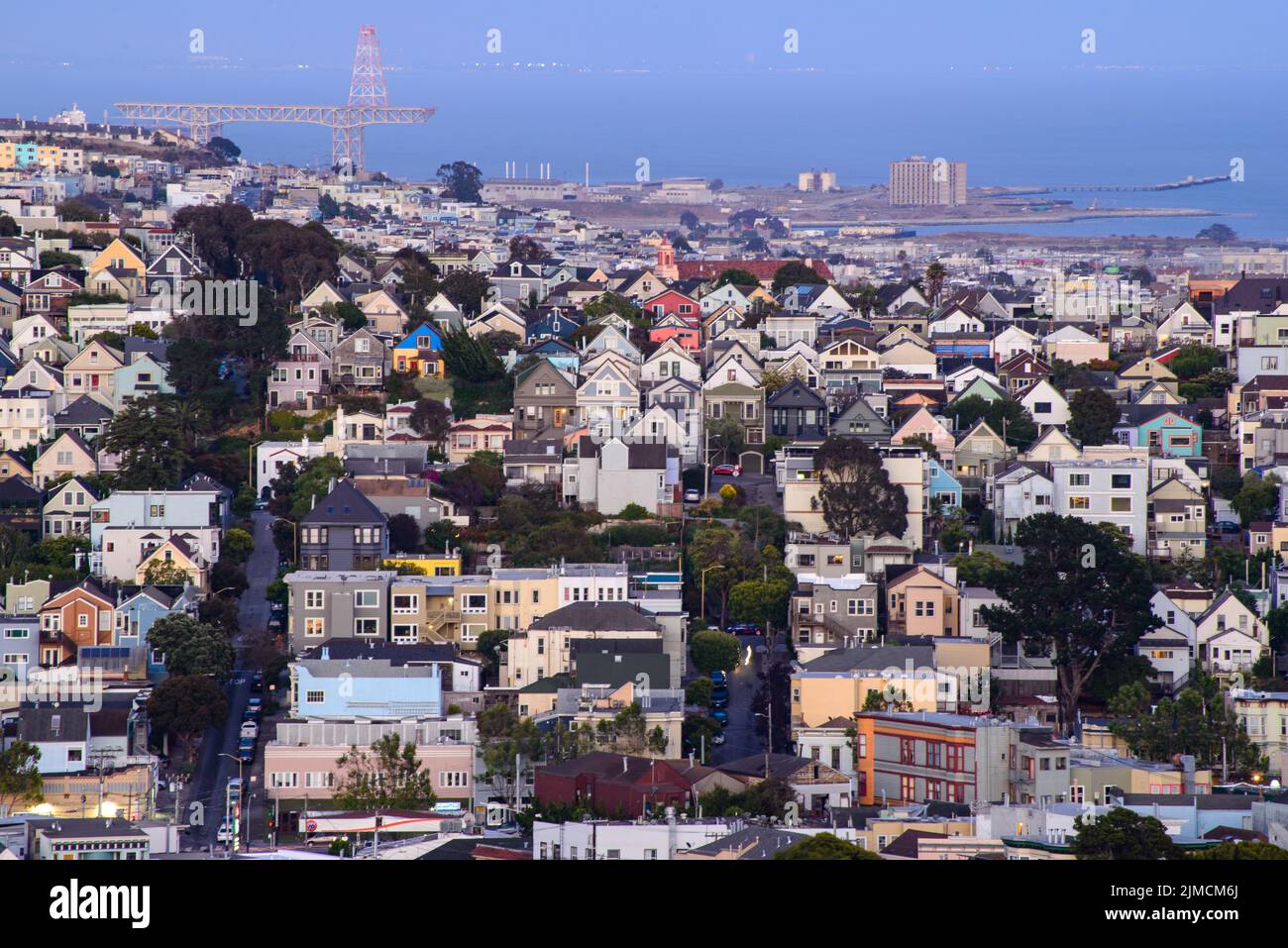 Rolling San Francisco hills with peaked roof homes and streets at
