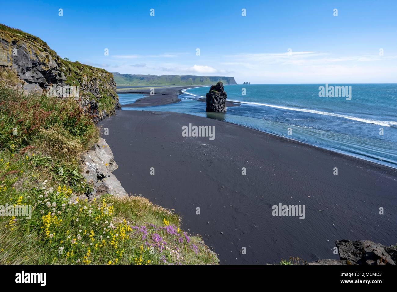 Rocks in the sea, View over Reynisfjara Beach, Black Sand Beach, Dyrholaey, South Iceland, Iceland Stock Photo