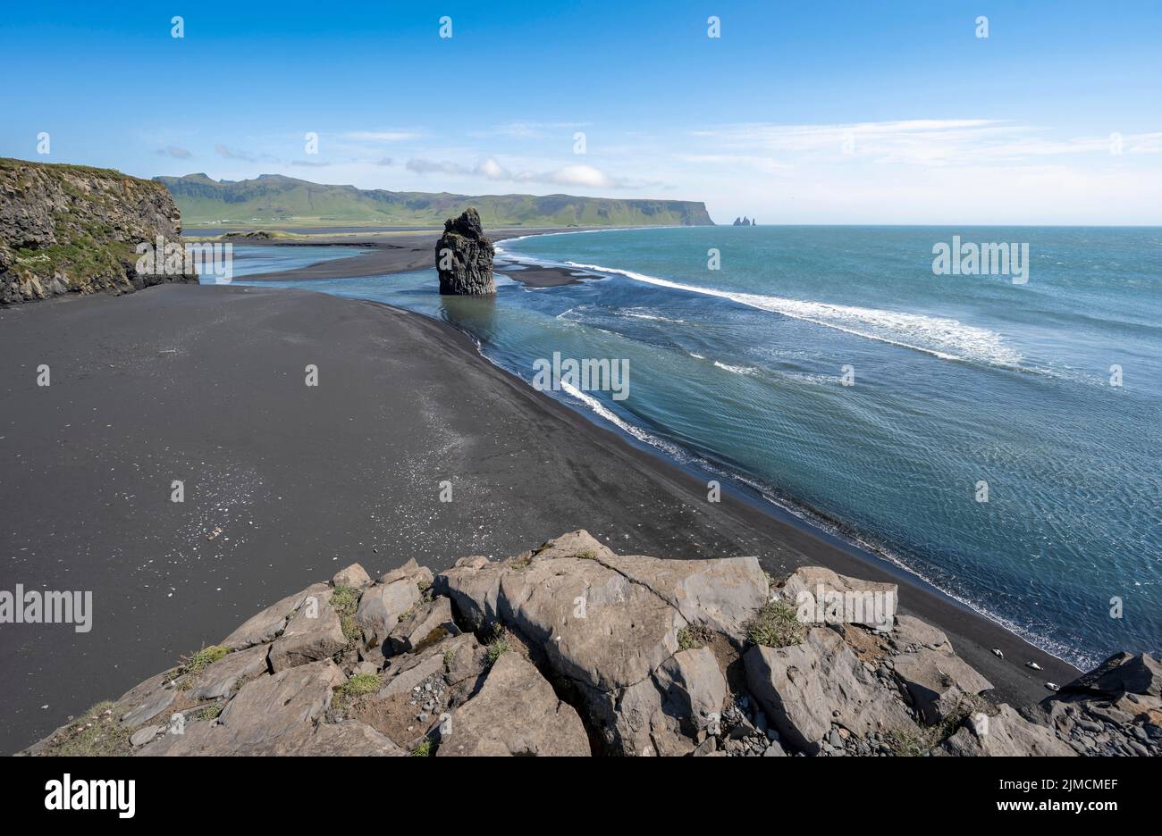 Rocks in the sea, View over Reynisfjara Beach, Black Sand Beach, Dyrholaey, South Iceland, Iceland Stock Photo