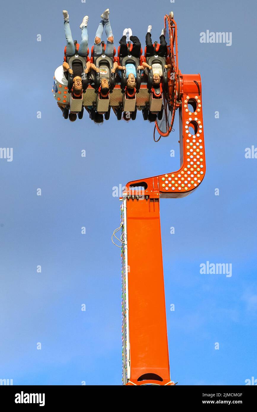 Crange, Herne, NRW, 05th Aug, 2022. People hang suspended in the air on the 55 metre high 'Apollo 13' ride. The official opening day of the 2022 Cranger Kirmes, Germany's 3rd largest funfair and the largest of its kind in NRW, sees thousands of visitors enjoying the carousels, roller coasters, beer halls, food stalls and other attractions. The popular fair, which was paused during the pandemic, regularly attracts more than 4m visitors during its 10 day run and has been established for decades in its current form, with the fair itself dating back to the early 18th century at Crange. Credit: Ima Stock Photo