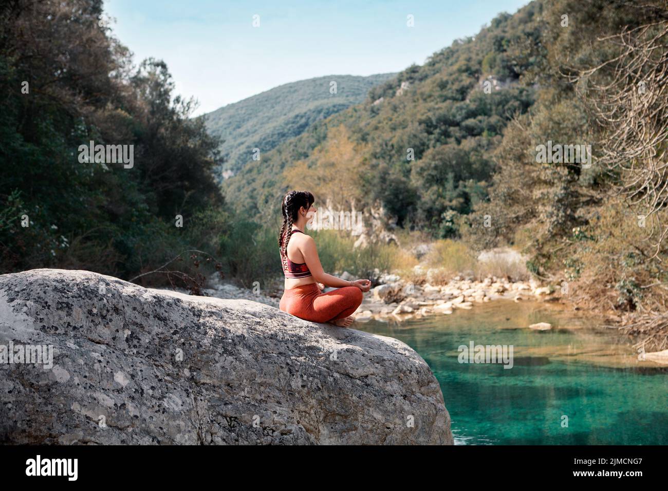 Woman practicing tadasana in the river Stock Photo