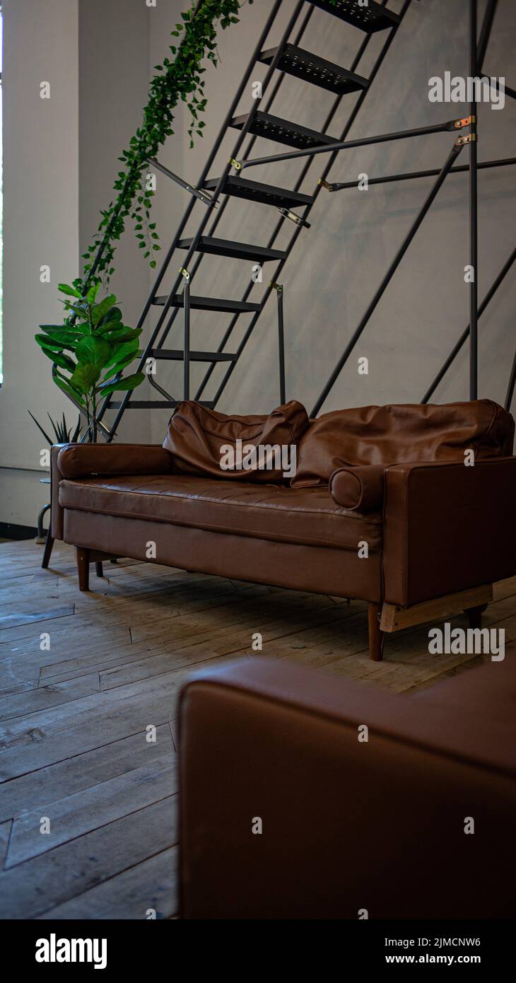 A Pretty shot of a couch in an industrial setting. Stock Photo