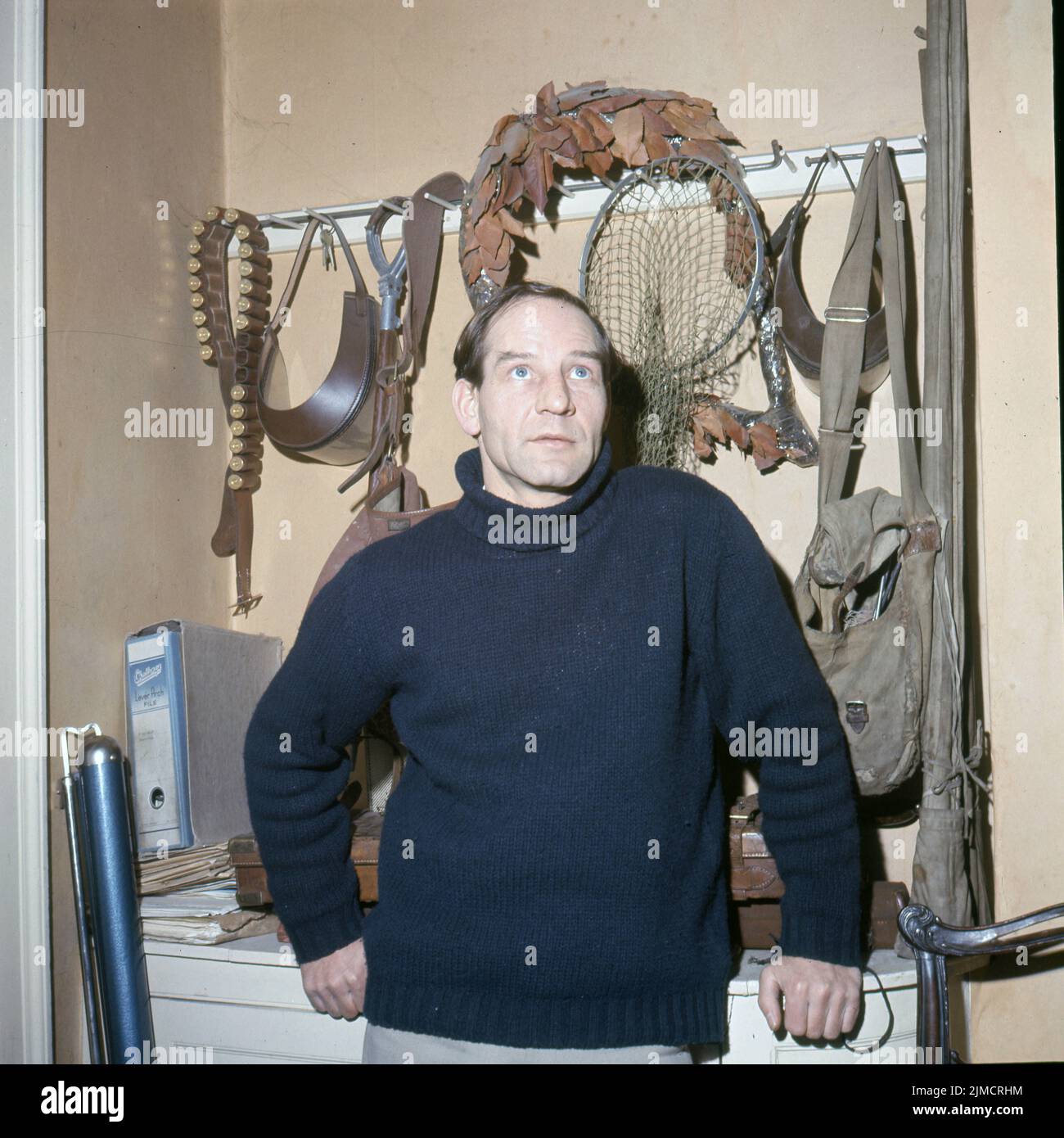 Circa 1965, London, England, United Kingdom: British Racing driver INNES IRELAND at home with his hunting gear. Lieutenant Robert McGregor Innes Ireland (12 June 1930 C 22 October 1993), was a British military officer, engineer, and motor racing driver, with 1 Formula 1 victory, and 8 Tourist Trophies. (Credit Image: © Keystone USA/ZUMA Press Wire) Stock Photo