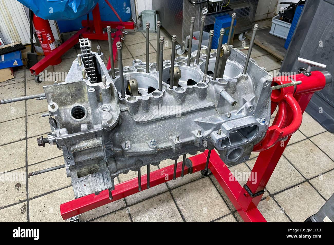 Engine block from Porsche 911 964 clean steam-blasted restored refurbished pre-assembled on rack mounting frame for assembly, Germany Stock Photo
