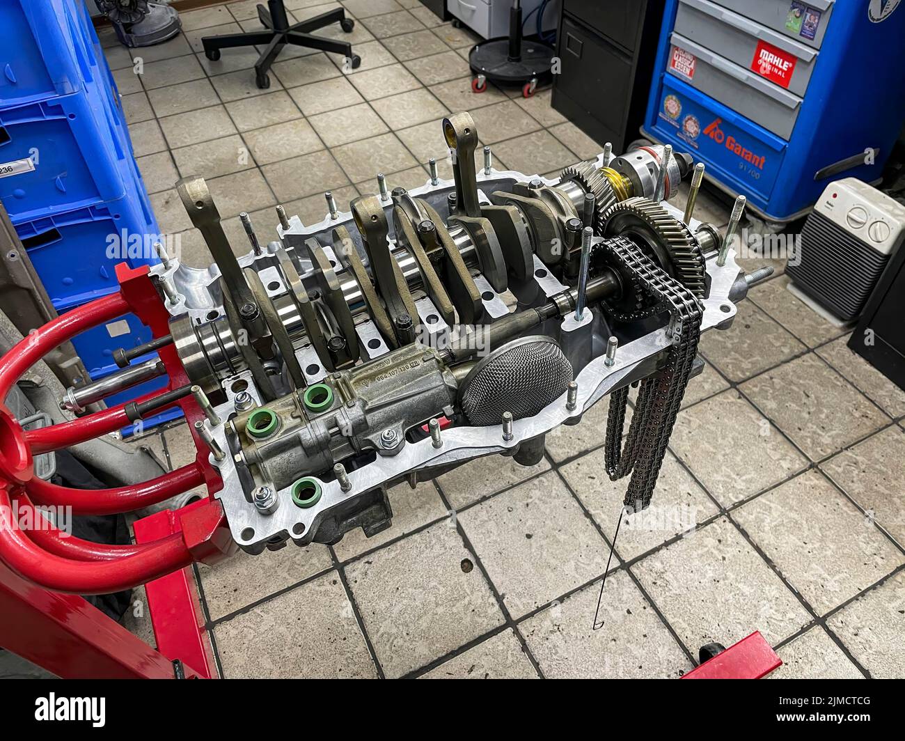 Gearbox for air-cooled engine of historic classic sports car classic car Porsche 911 964 overhauled restored in workshop on rack for assembly Stock Photo