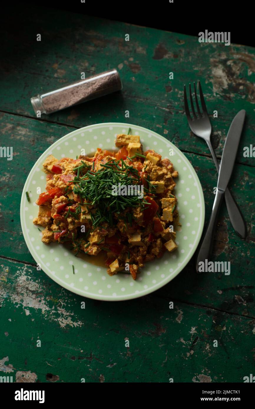 Vegan scrambled eggs with smoked tofu, chives and salt Stock Photo Alamy