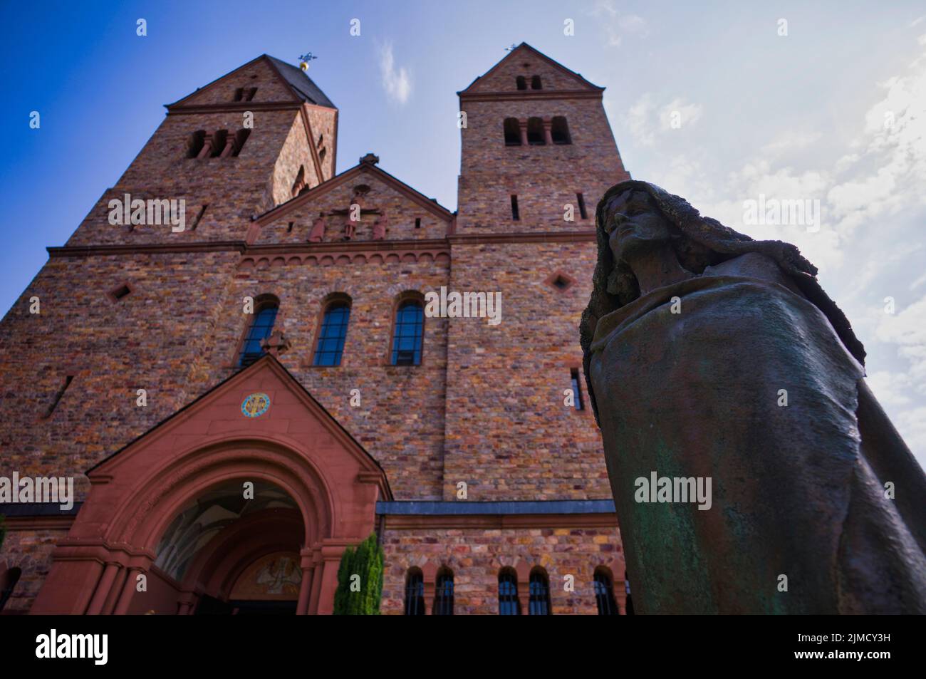Statue of Saint Hildegard of Bingen in front of the abbey church, St. Hildegard Abbey, Benedictine Abbey, Eibingen near Ruedesheim, Rheingau, Taunus Stock Photo