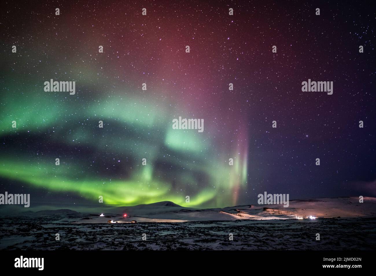 Amazing view of aurora borealis glowing in night sky with stars over ...