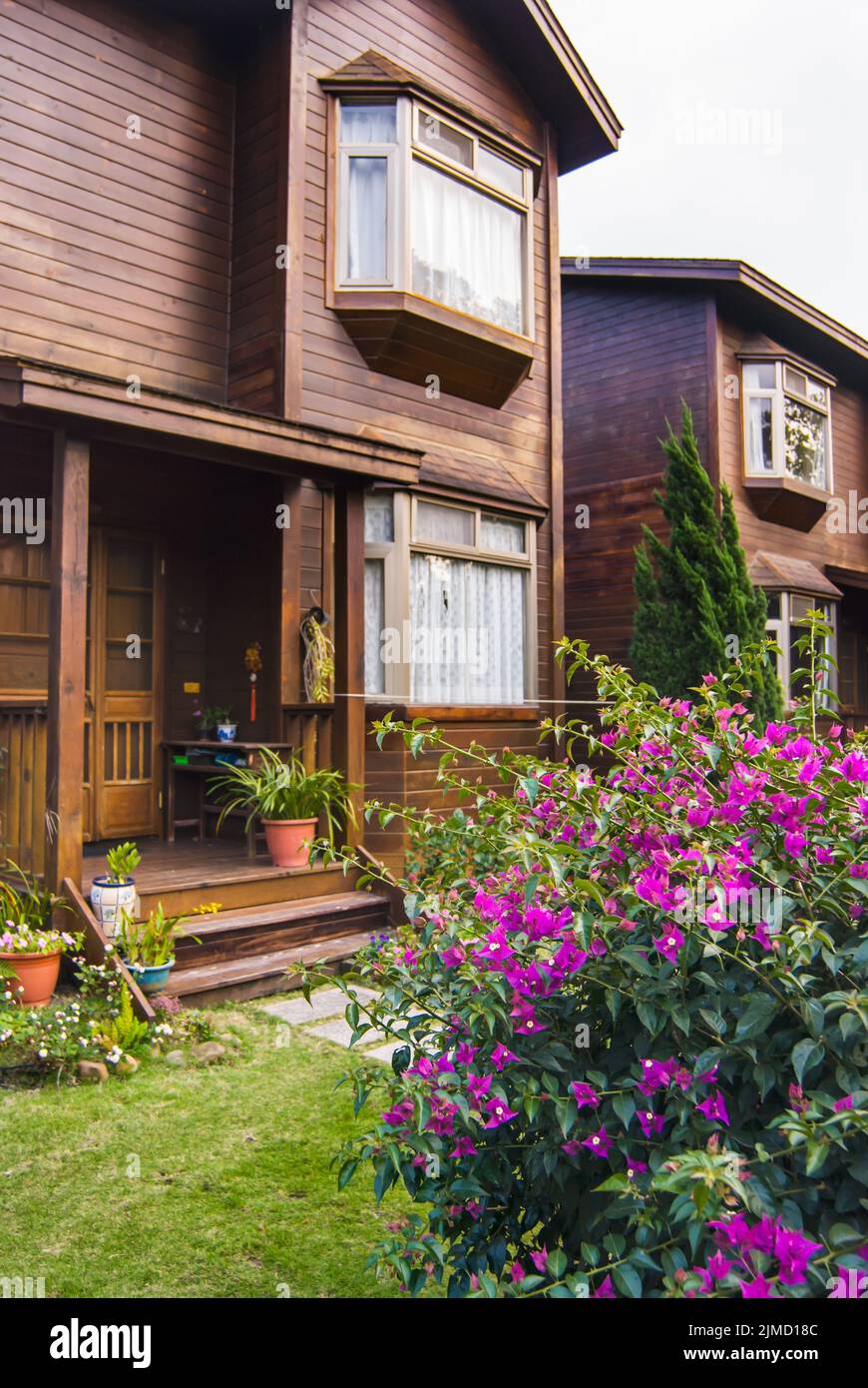 Door of wooden house and flower in garden Stock Photo - Alamy