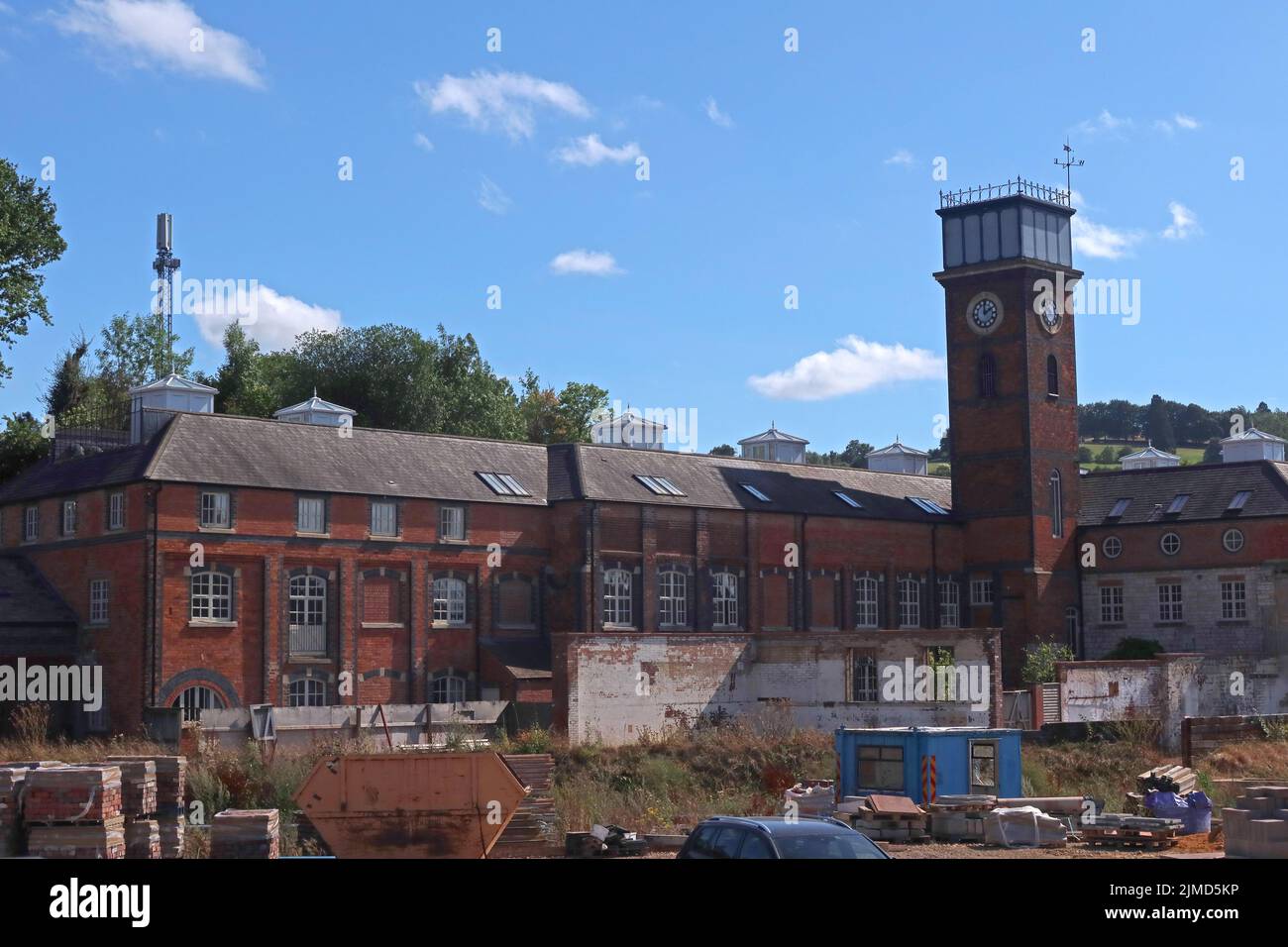 Clock tower, factory buildings and Avocet industrial estate, at Dudbridge, Stroud, Gloucestershire, England, UK, GL5 Stock Photo