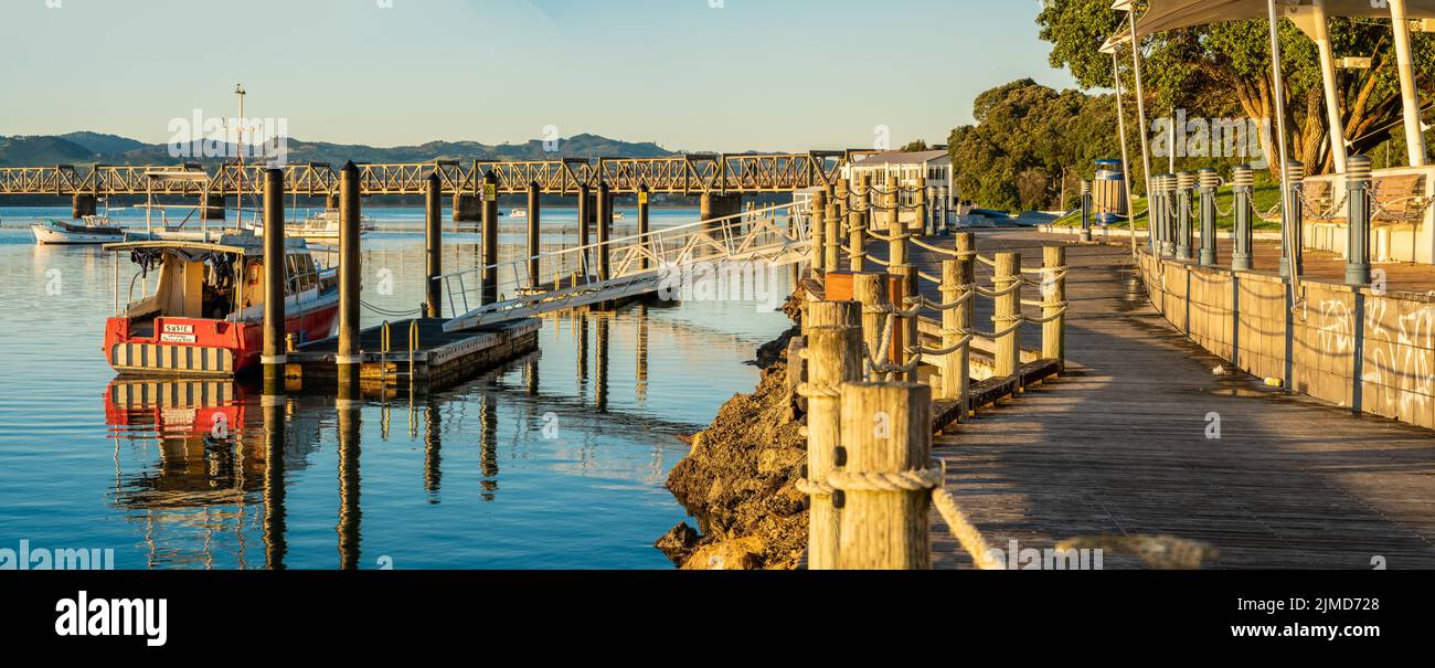 Tauranga New Zealand - August 5 2022; Quaint boat moored at pier on downtown waterfront alongside walkway. Stock Photo