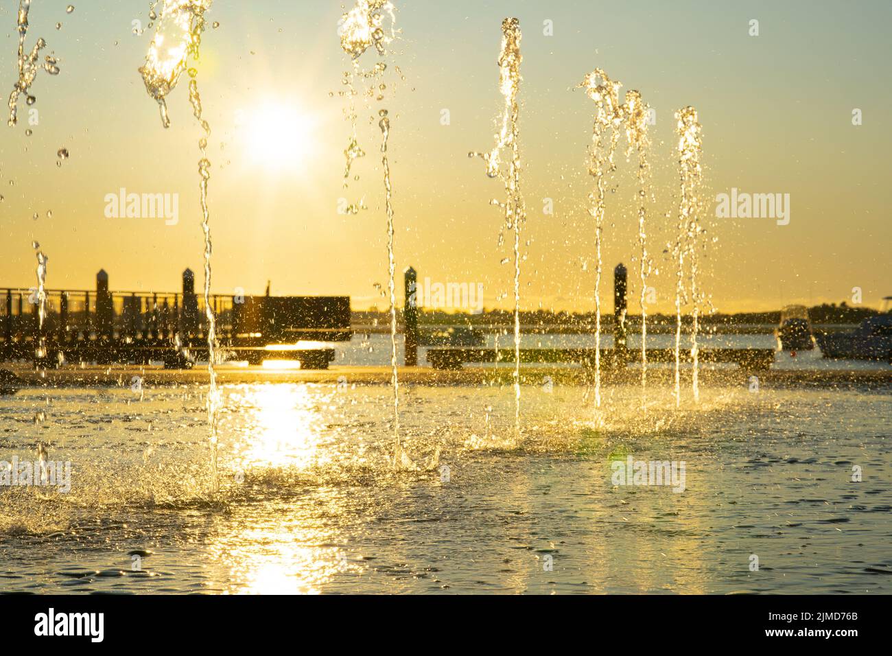 Water feature spraying waters in morning light on Tauranga Strand waterfront Stock Photo