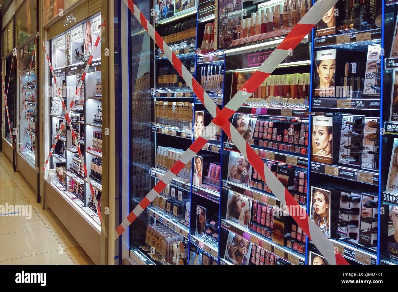 Beauty store with cosmetics testers behind barrier tape cross, Moscow 20/08/2020 Stock Photo