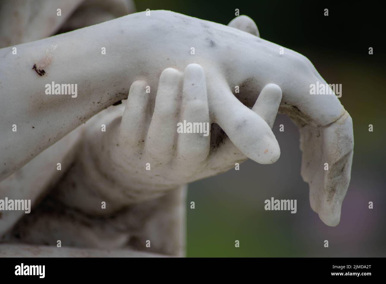 Stone sculpted hands of Jesus and Mary in an old cemetery Stock Photo ...