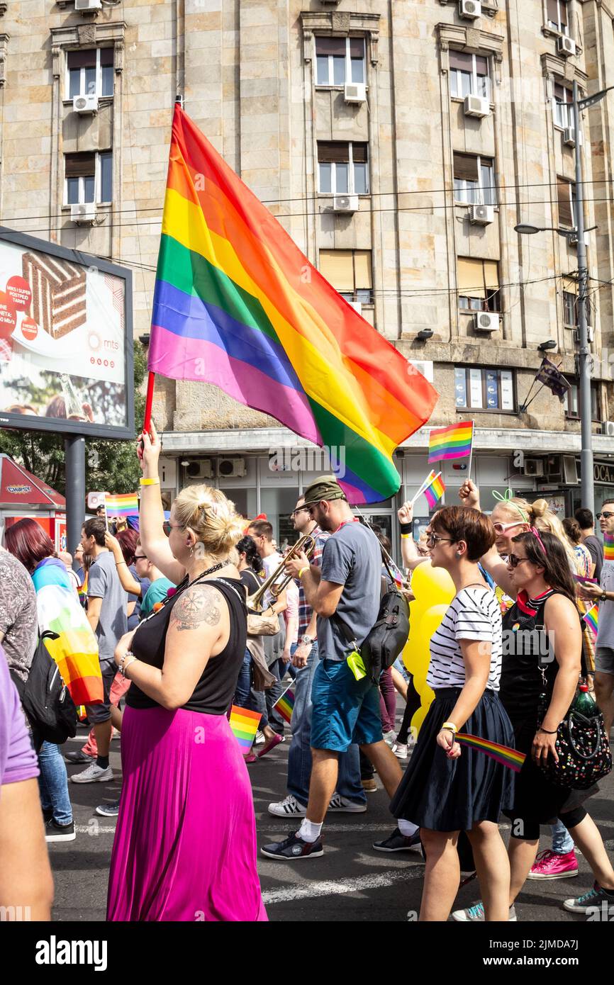 Picture of a group of people, gay pride participants, women, holding and raising rainbow flags, symbol of the homosexual struggle, during the 2016  ed Stock Photo